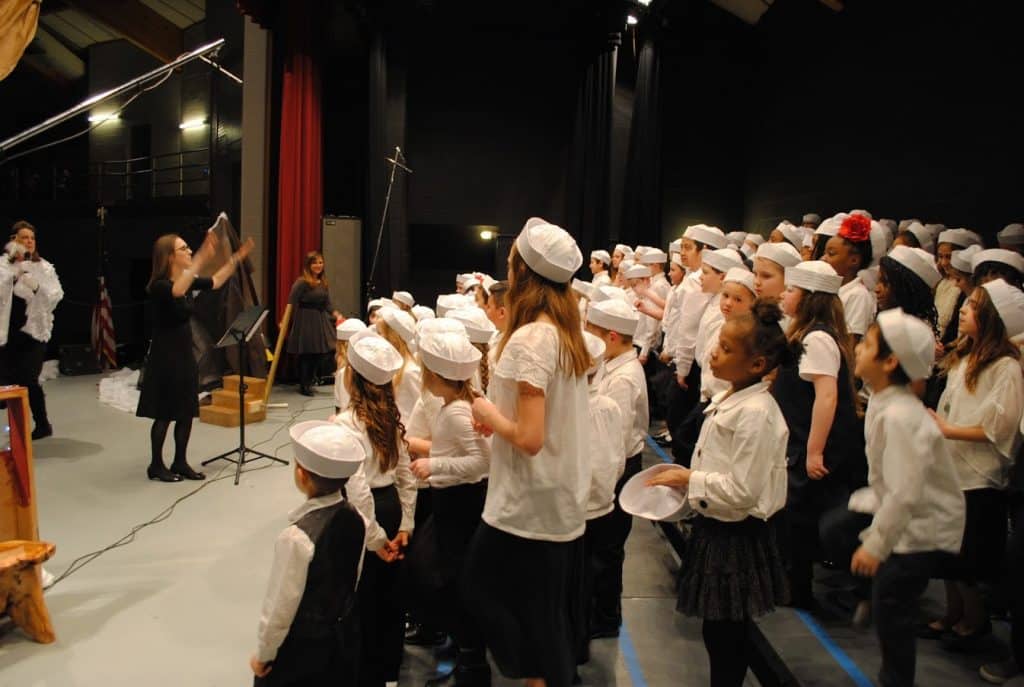 Carolyn leading the children's choir backstage at Operation Arctic